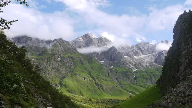 The valley opening out below a line of Himalayan peaks