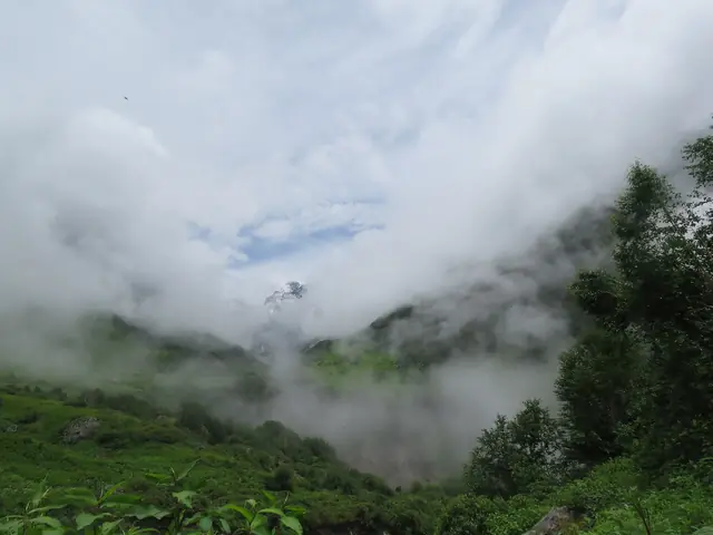 Cloud lifting off the peaks after rain