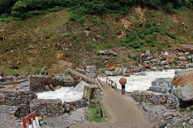 Crossing the Pushpawati on the old bridge