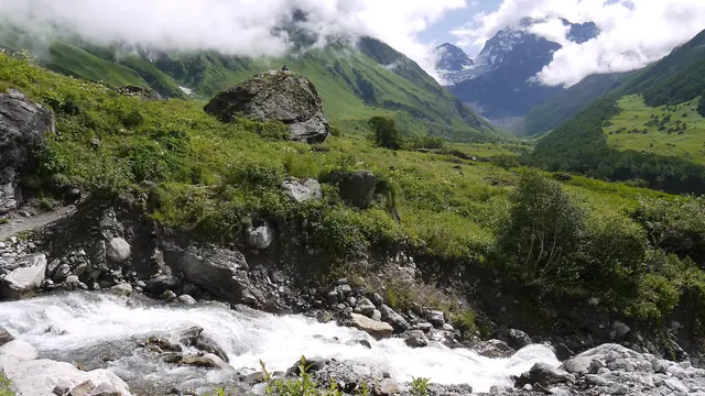 A stream racing down from the snow peaks