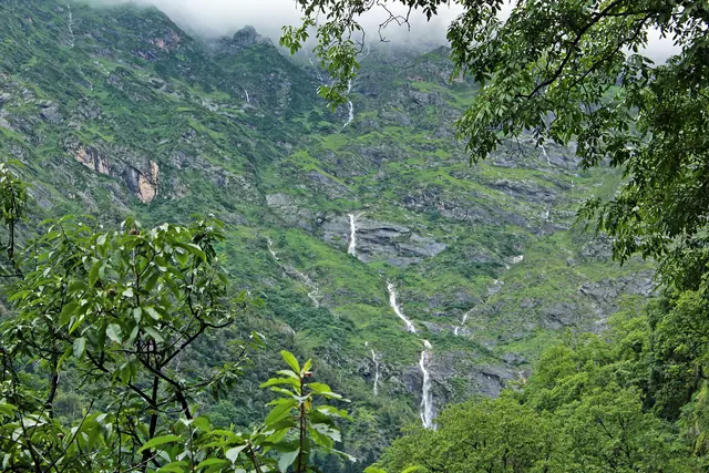 Waterfalls threading down the valley walls